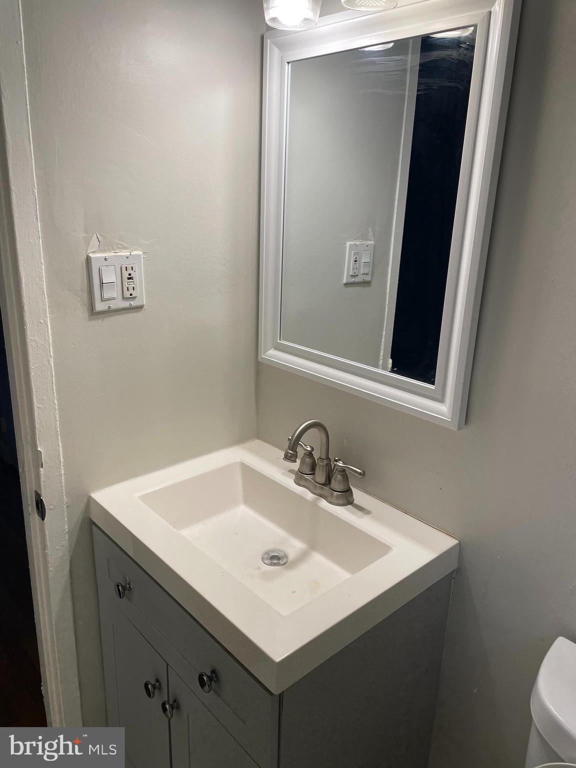 2307 Wyngate Road Suitland, MD 20746 - Photo 12 of 22 a bathroom with a sink and a toilet