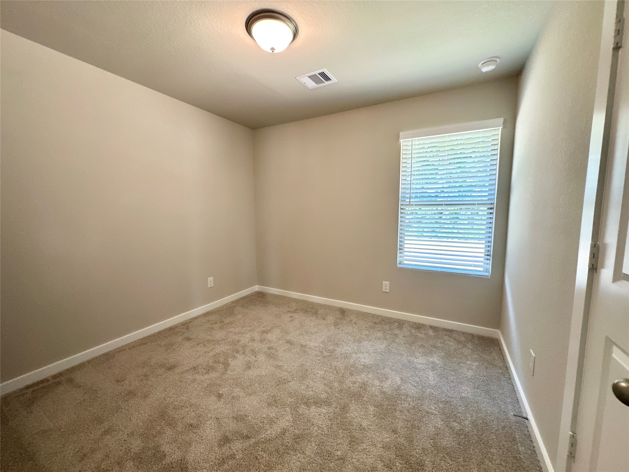 12187 Ridge Top Drive Conroe, TX 77304 - Photo 11 of 26 an empty room with a empty space and windows