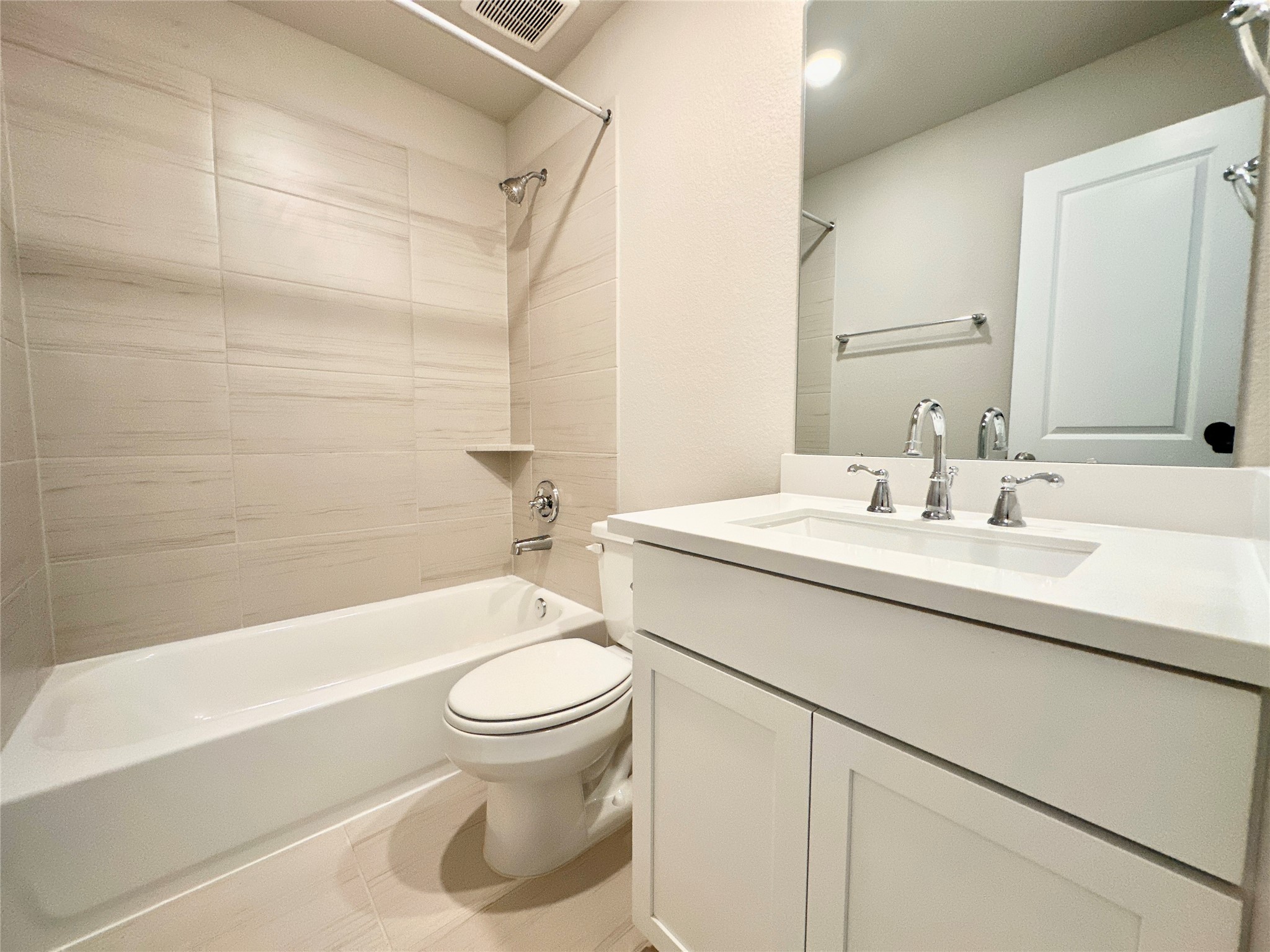 12187 Ridge Top Drive Conroe, TX 77304 - Photo 13 of 26 a bathroom with a sink toilet and shower