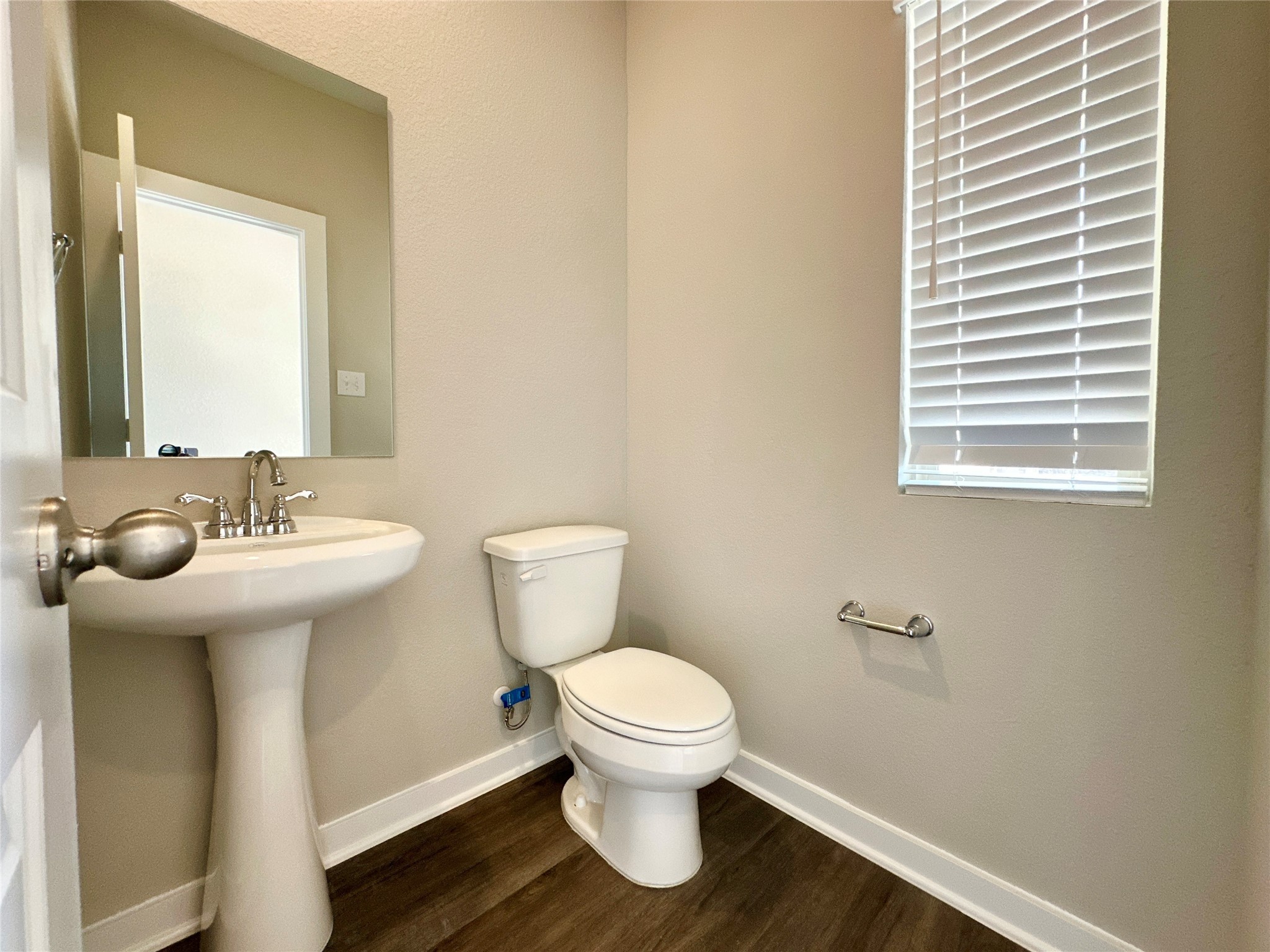 12187 Ridge Top Drive Conroe, TX 77304 - Photo 14 of 26 a bathroom with a sink toilet and a mirror