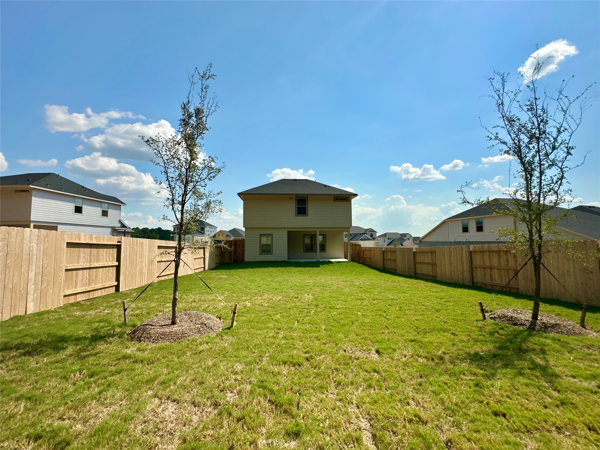 12187 Ridge Top Drive Conroe, TX 77304 - Photo 17 of 26 a house view with a garden space