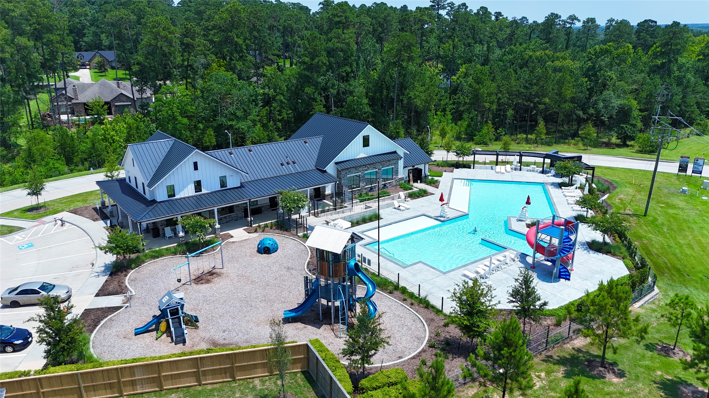 12187 Ridge Top Drive Conroe, TX 77304 - Photo 18 of 26 an aerial view of a house with a garden and swimming pool