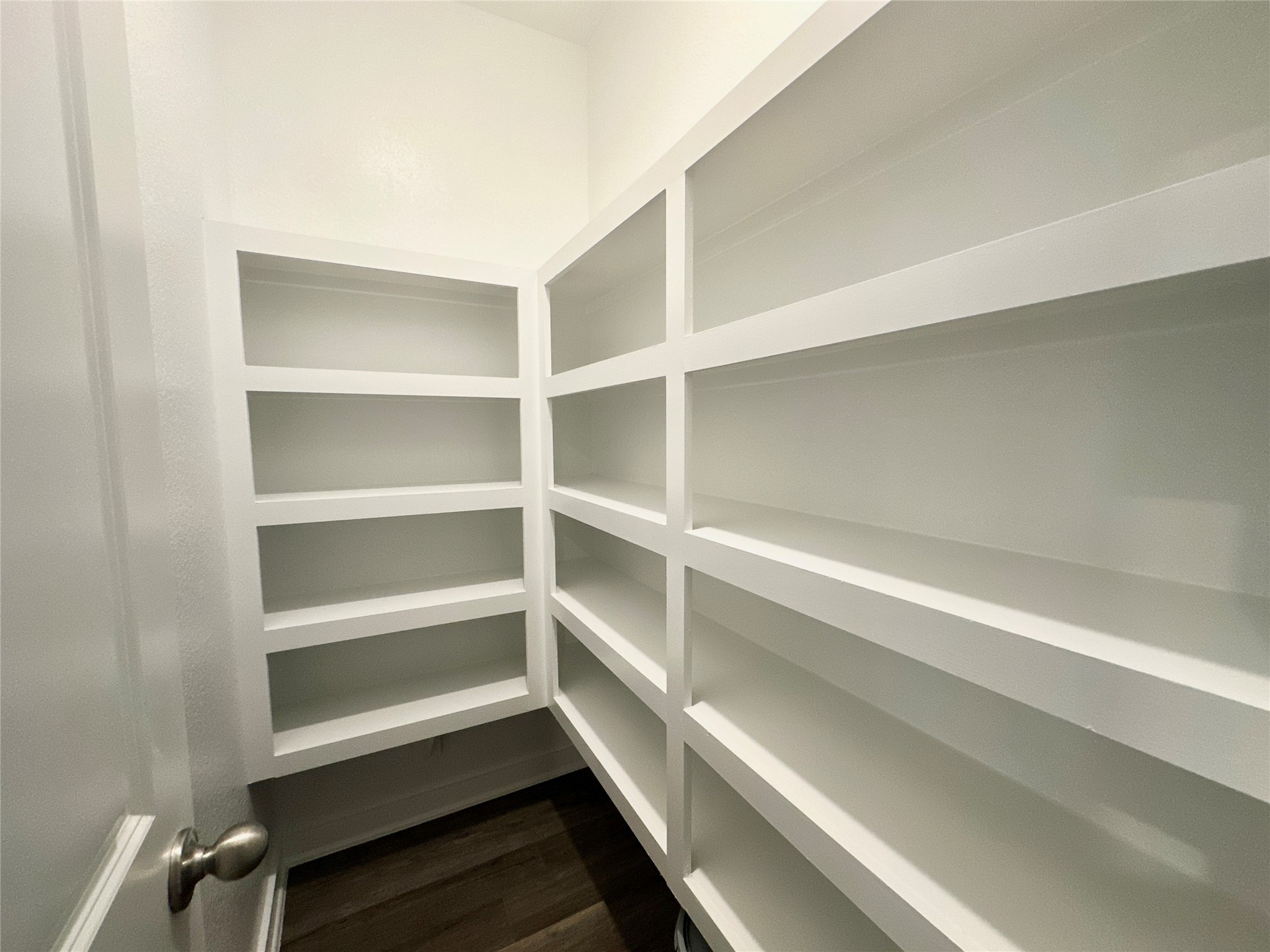 12187 Ridge Top Drive Conroe, TX 77304 - Photo 6 of 26 a view of walk in closet with empty racks