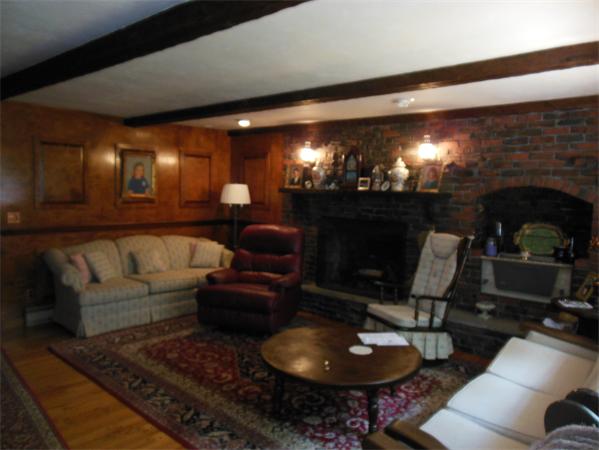 11 Temi Road Beverly, MA 01915 - Photo 7 of 30 a living room with furniture a lamp and a fireplace