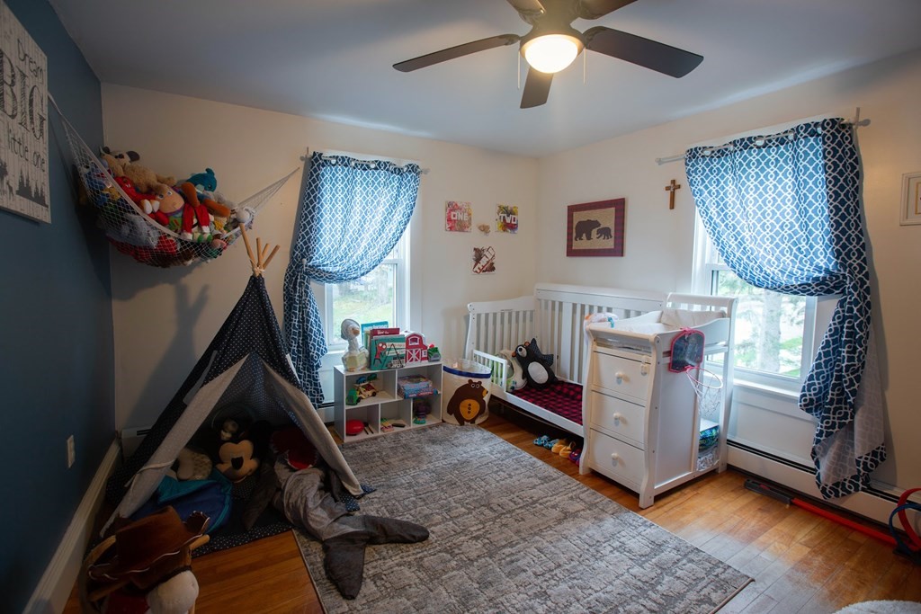 9 Clinton Street Ware, MA 01082 - Photo 11 of 25 a room with lots of furniture and a chandelier