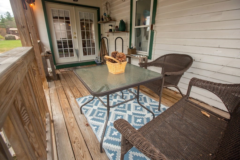 9 Clinton Street Ware, MA 01082 - Photo 13 of 25 a view of a balcony dining table and chairs