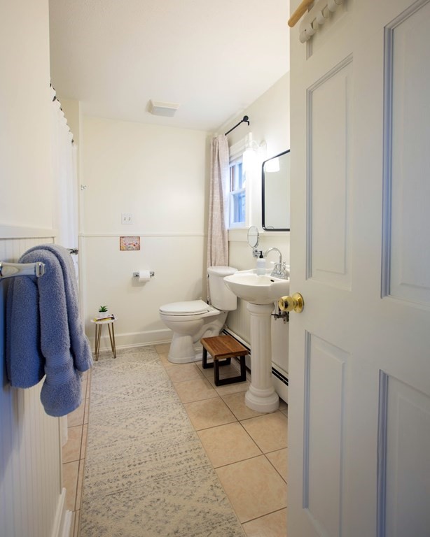 9 Clinton Street Ware, MA 01082 - Photo 15 of 25 a bathroom with a sink and a mirror
