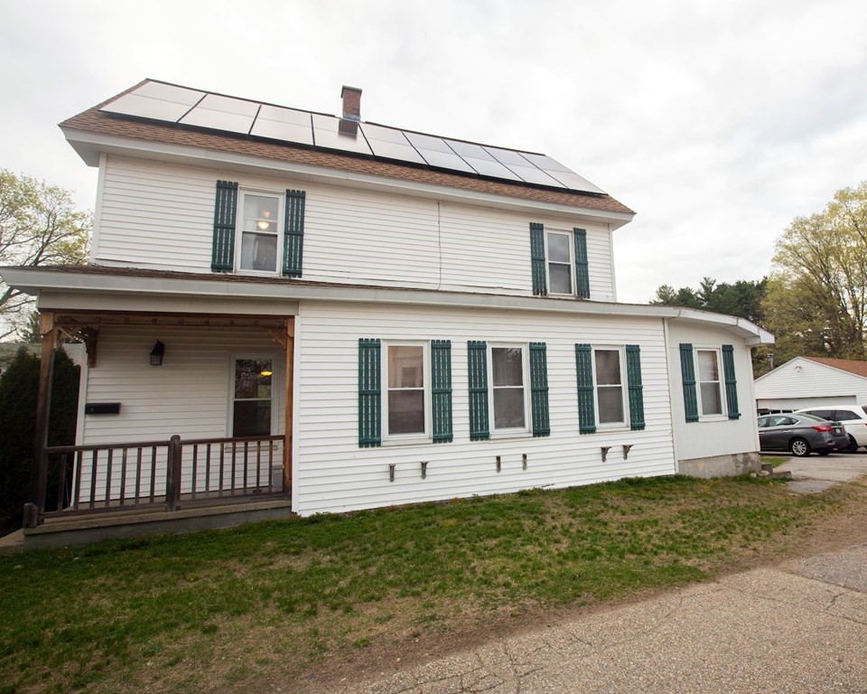 9 Clinton Street Ware, MA 01082 - Photo 2 of 25 a front view of a house with a yard