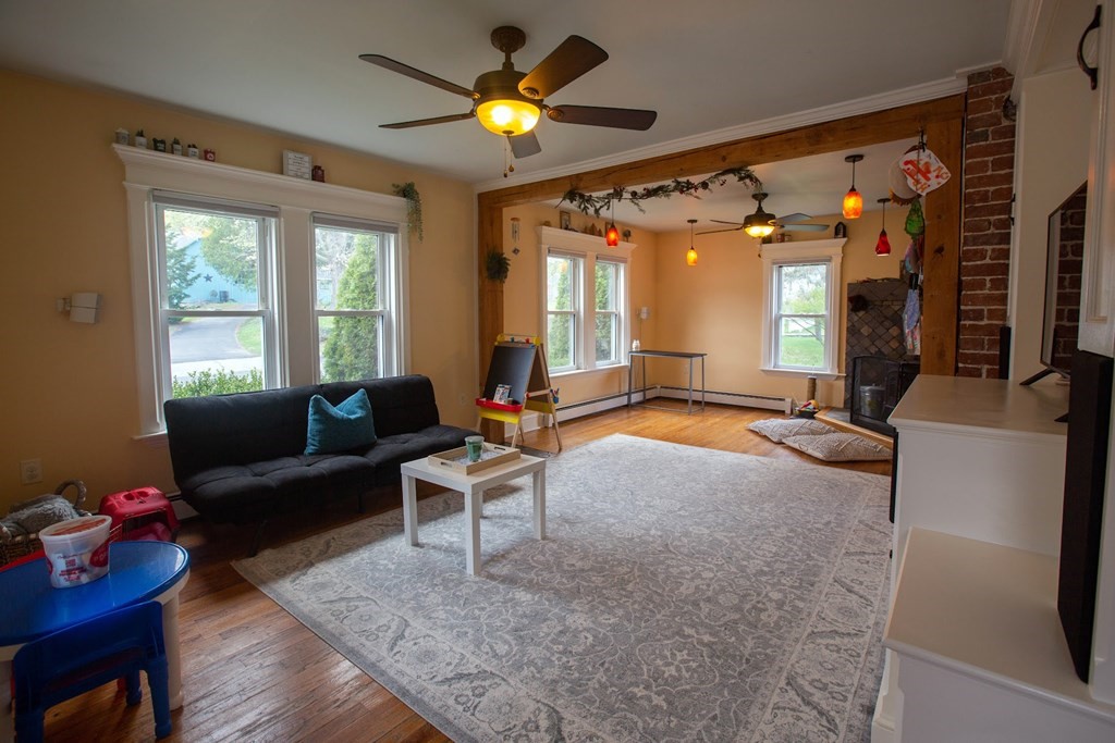 9 Clinton Street Ware, MA 01082 - Photo 7 of 25 a living room with furniture and a flat screen tv