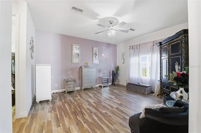 a view of a livingroom with furniture window and wooden floor