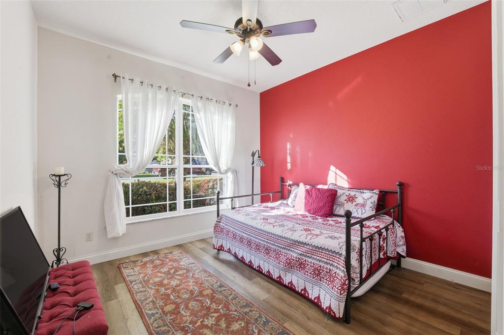 1733 West Caroline Path Lecanto, FL 34461 - Photo 16 of 29 a bedroom with a bed and wooden floor