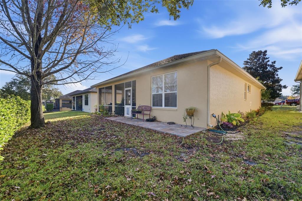 1733 West Caroline Path Lecanto, FL 34461 - Photo 20 of 29 a view of a house with backyard and garden