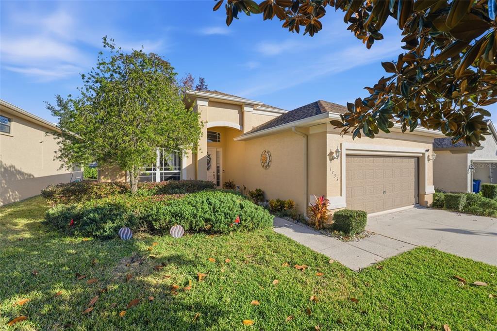 1733 West Caroline Path Lecanto, FL 34461 - Photo 24 of 29 a front view of a house with a yard