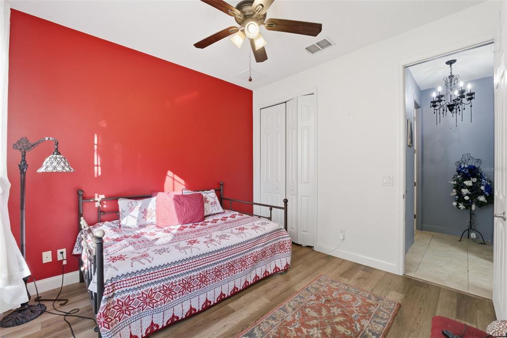 1733 West Caroline Path Lecanto, FL 34461 - Photo 29 of 29 a bedroom with a bed and a chandelier