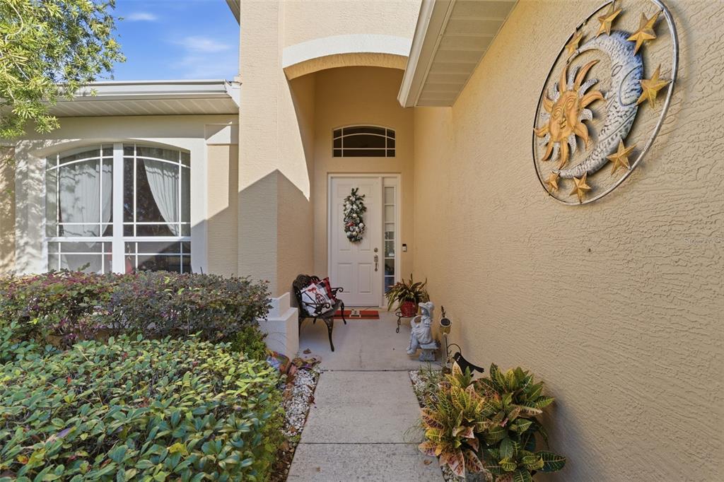 1733 West Caroline Path Lecanto, FL 34461 - Photo 3 of 29 a front view of a house with garden