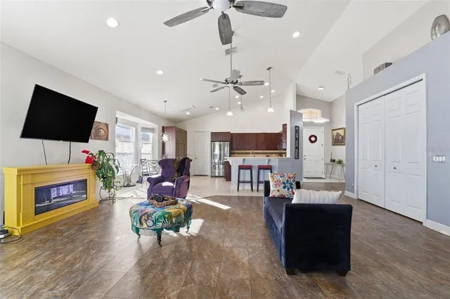 a living room with fireplace furniture and a flat screen tv