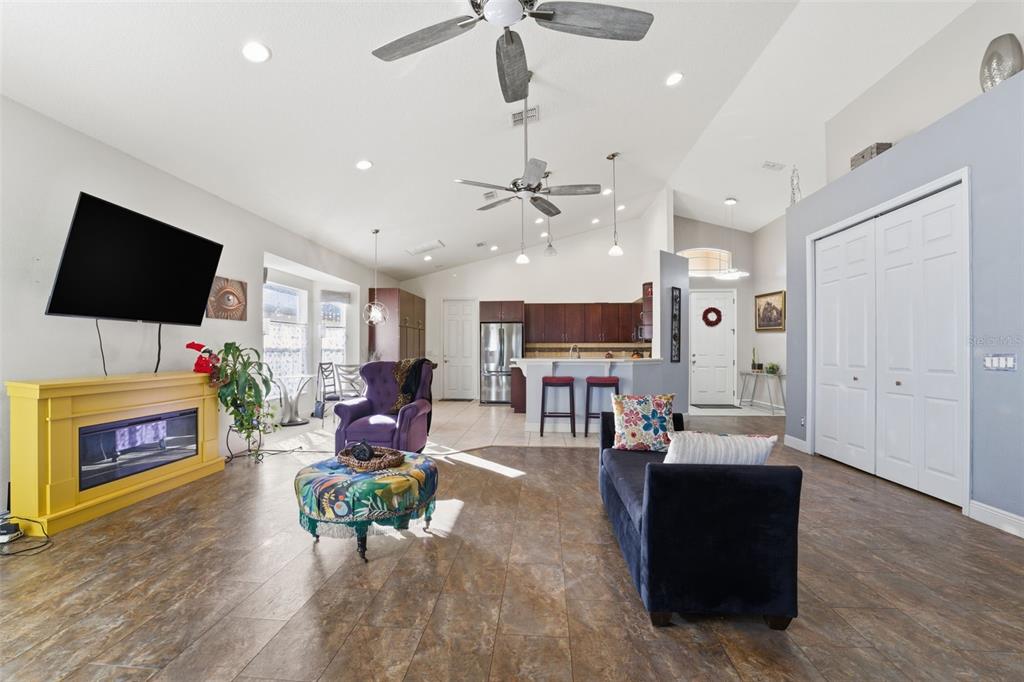 1733 West Caroline Path Lecanto, FL 34461 - Photo 7 of 29 a living room with fireplace furniture and a flat screen tv