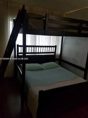 a balcony with table and chairs