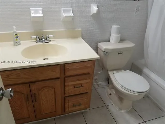 a bedroom with a bed and a wall painting