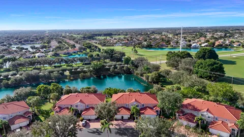 an aerial view of residential houses and lake view