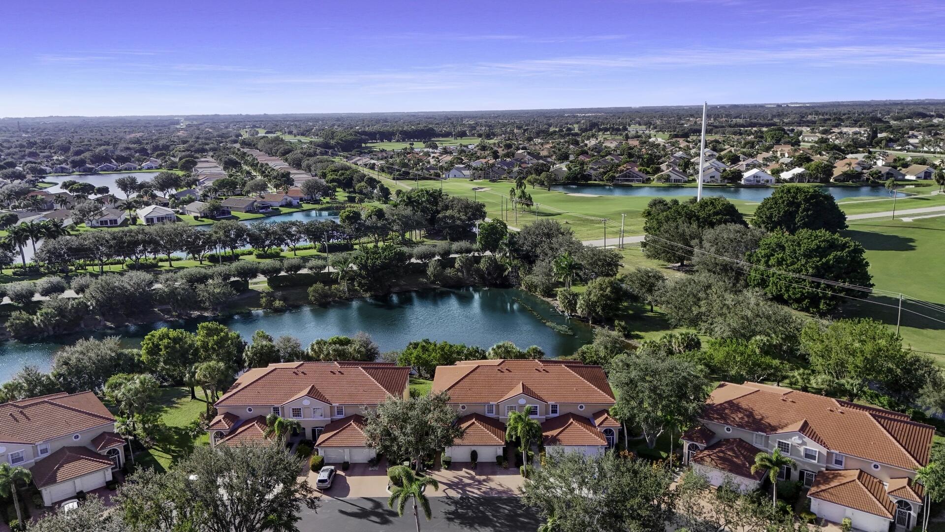 an aerial view of residential houses and lake view