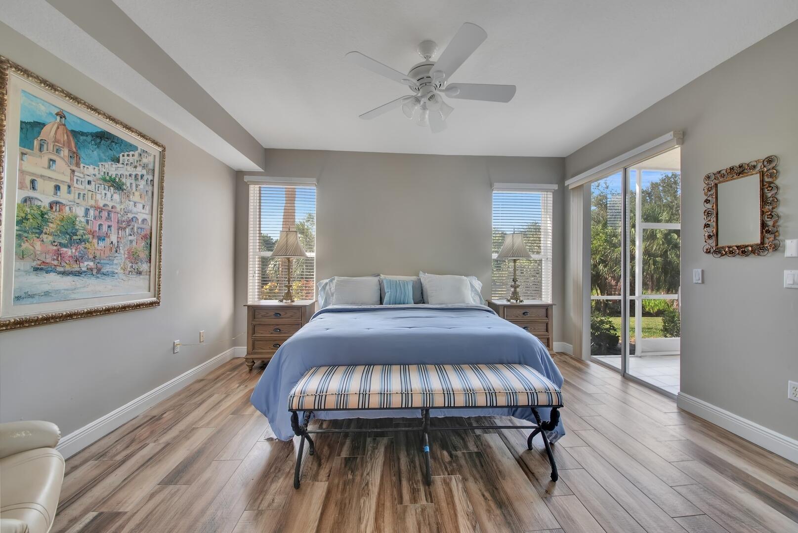 12438 Crystal Pointe Drive, Unit 102 Boynton Beach, FL 33437 - Photo 14 of 39 a bedroom with a bed and a painting on the wall