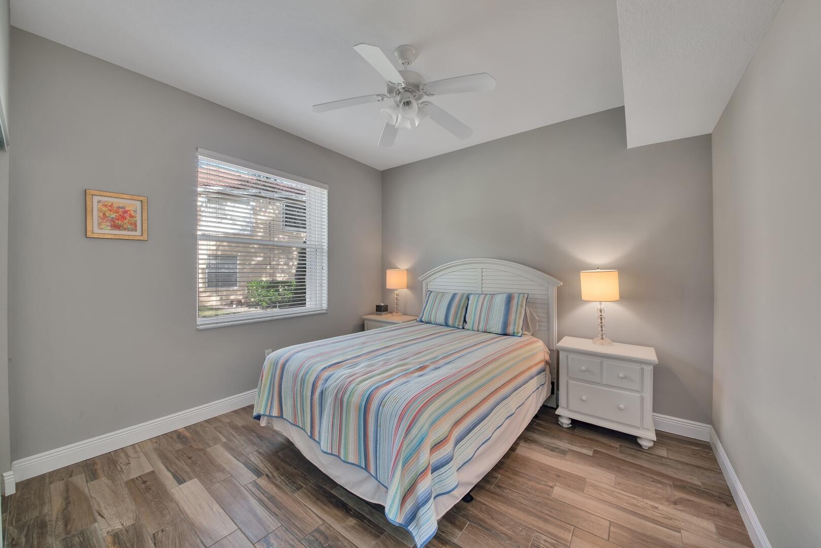 12438 Crystal Pointe Drive, Unit 102 Boynton Beach, FL 33437 - Photo 22 of 39 a bedroom with a bed and a window