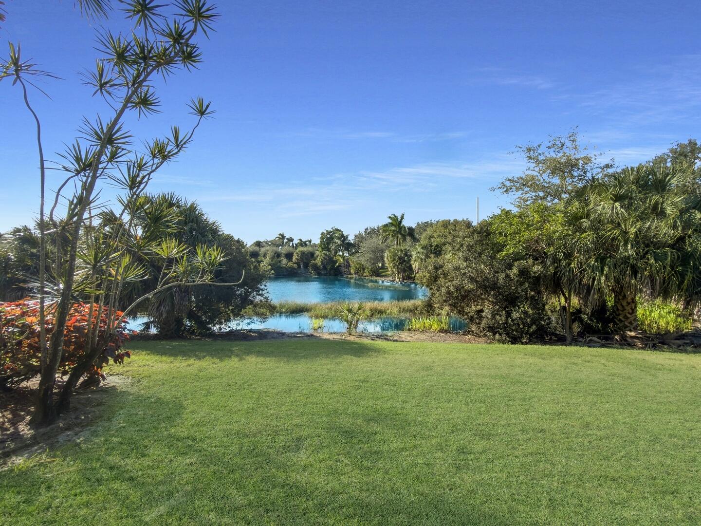 12438 Crystal Pointe Drive, Unit 102 Boynton Beach, FL 33437 - Photo 30 of 39 a view of a lake with houses in the background