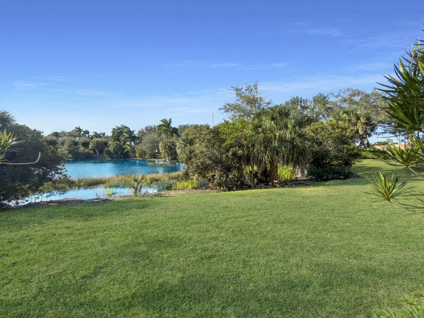 12438 Crystal Pointe Drive, Unit 102 Boynton Beach, FL 33437 - Photo 32 of 39 a view of a lake with houses in the back