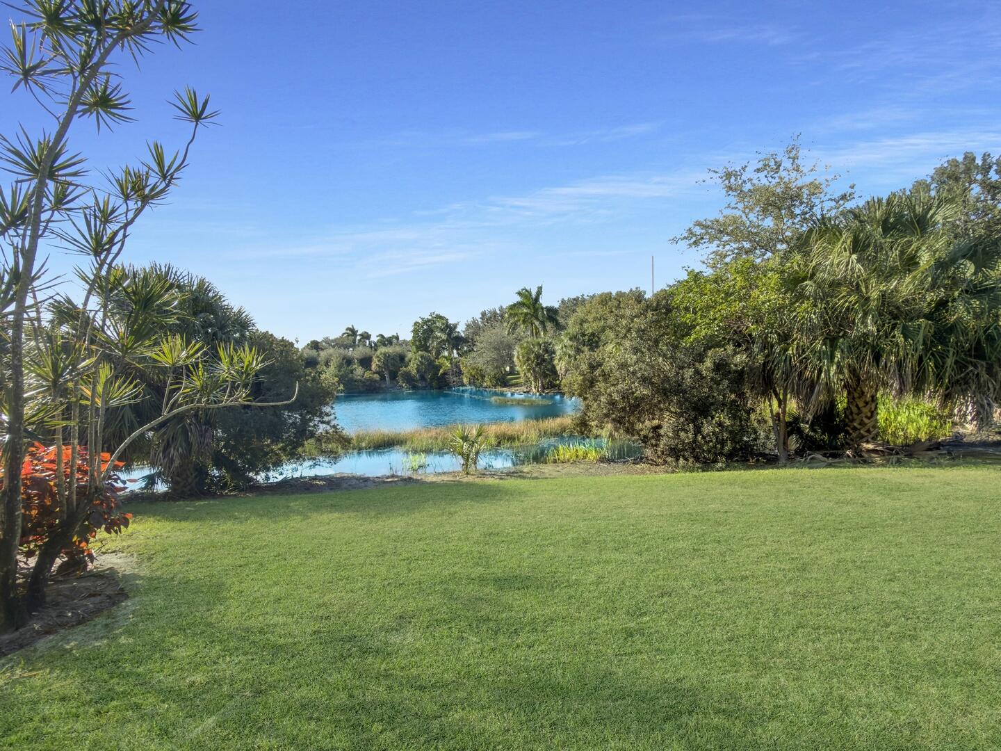 12438 Crystal Pointe Drive, Unit 102 Boynton Beach, FL 33437 - Photo 33 of 39 a view of a field of grass and trees