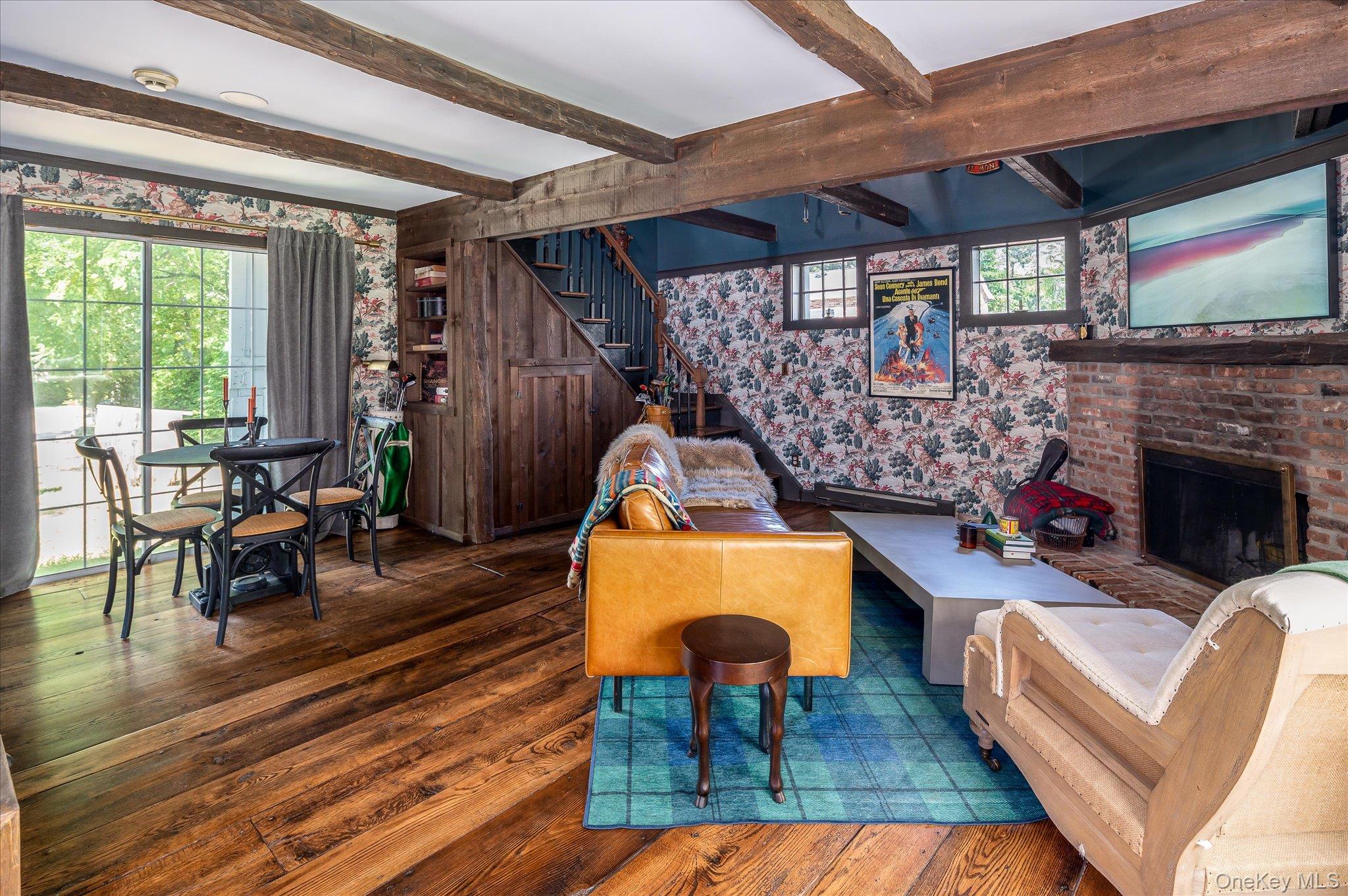 459 Old Post Road Bedford, NY 10506 - Photo 3 of 23 Living room featuring hardwood floors, a fireplace, beamed ceiling
