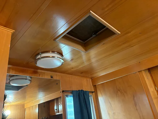 a room with a couch and a dresser