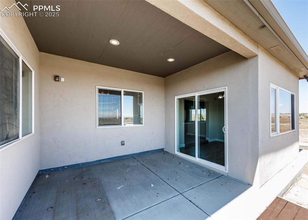 2105 Slocum Road Peyton, CO 80831 - Photo 12 of 27 Covered concrete patio.