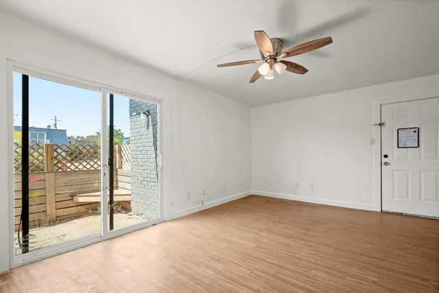 a view of kitchen with sink and wooden floor