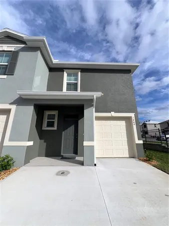 a front view of a house with a garage