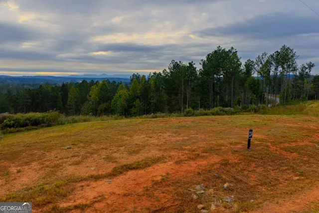 a view of a swimming pool with an outdoor space and seating area