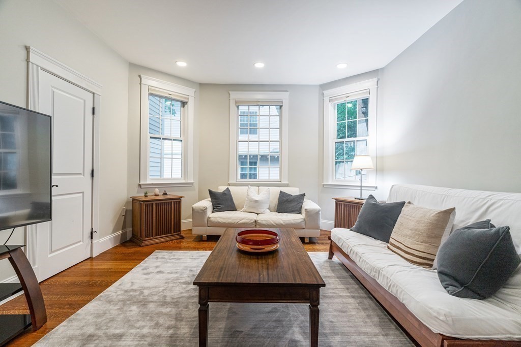 91 University Road, Unit 1 Brookline, MA 02445 - Photo 13 of 39 a living room with furniture and a window