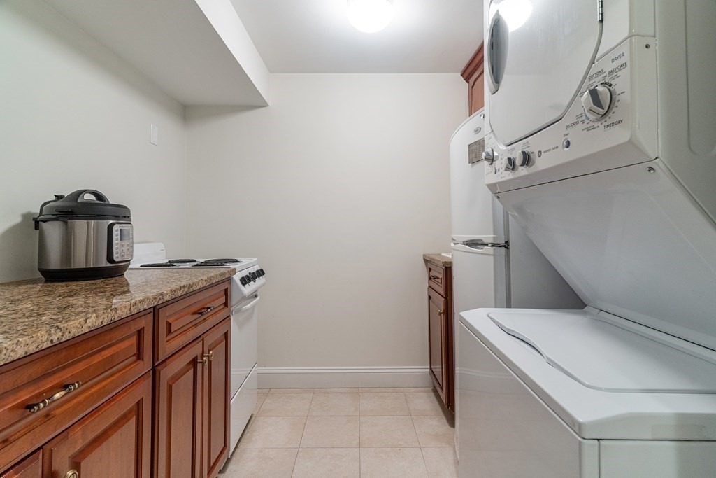 91 University Road, Unit 1 Brookline, MA 02445 - Photo 33 of 39 a utility room with dryer and washer