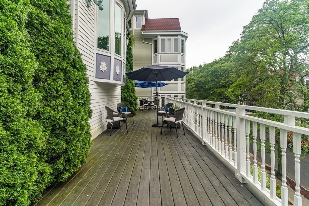 91 University Road, Unit 1 Brookline, MA 02445 - Photo 35 of 39 a roof deck view with a seating space