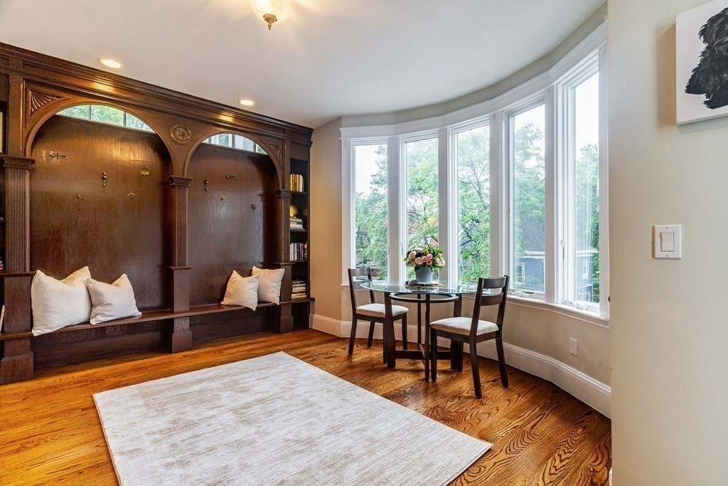 91 University Road, Unit 1 Brookline, MA 02445 - Photo 6 of 39 a living room with furniture and a rug