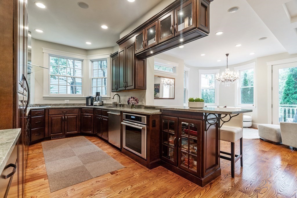 91 University Road, Unit 1 Brookline, MA 02445 - Photo 10 of 39 a kitchen with stainless steel appliances granite countertop a stove and a sink
