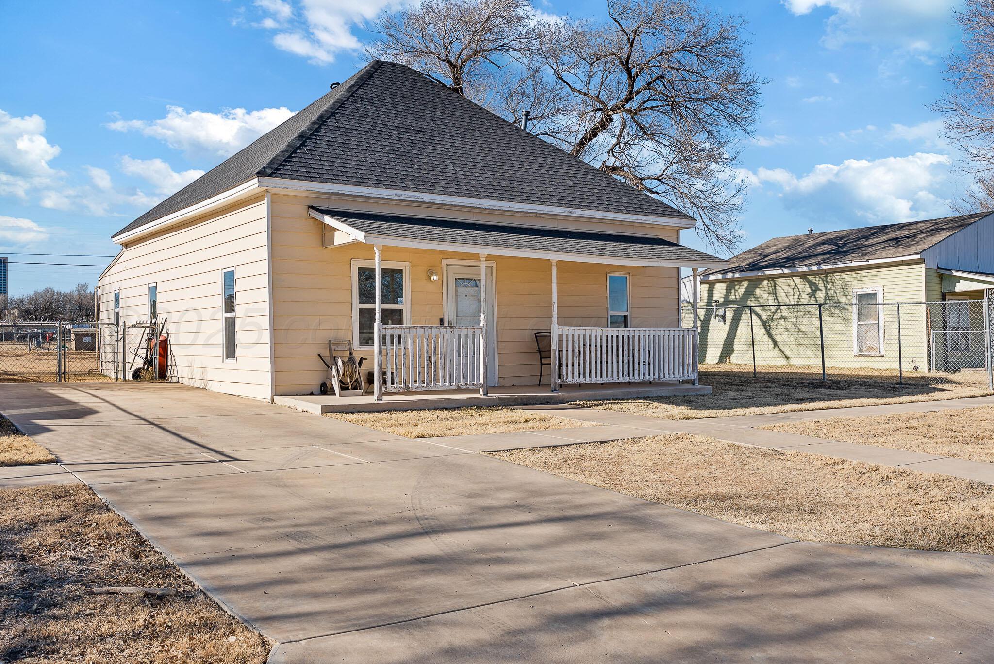 702 South Cleveland Street Amarillo, TX 79102 - Photo 2 of 11 a front view of a house with a yard