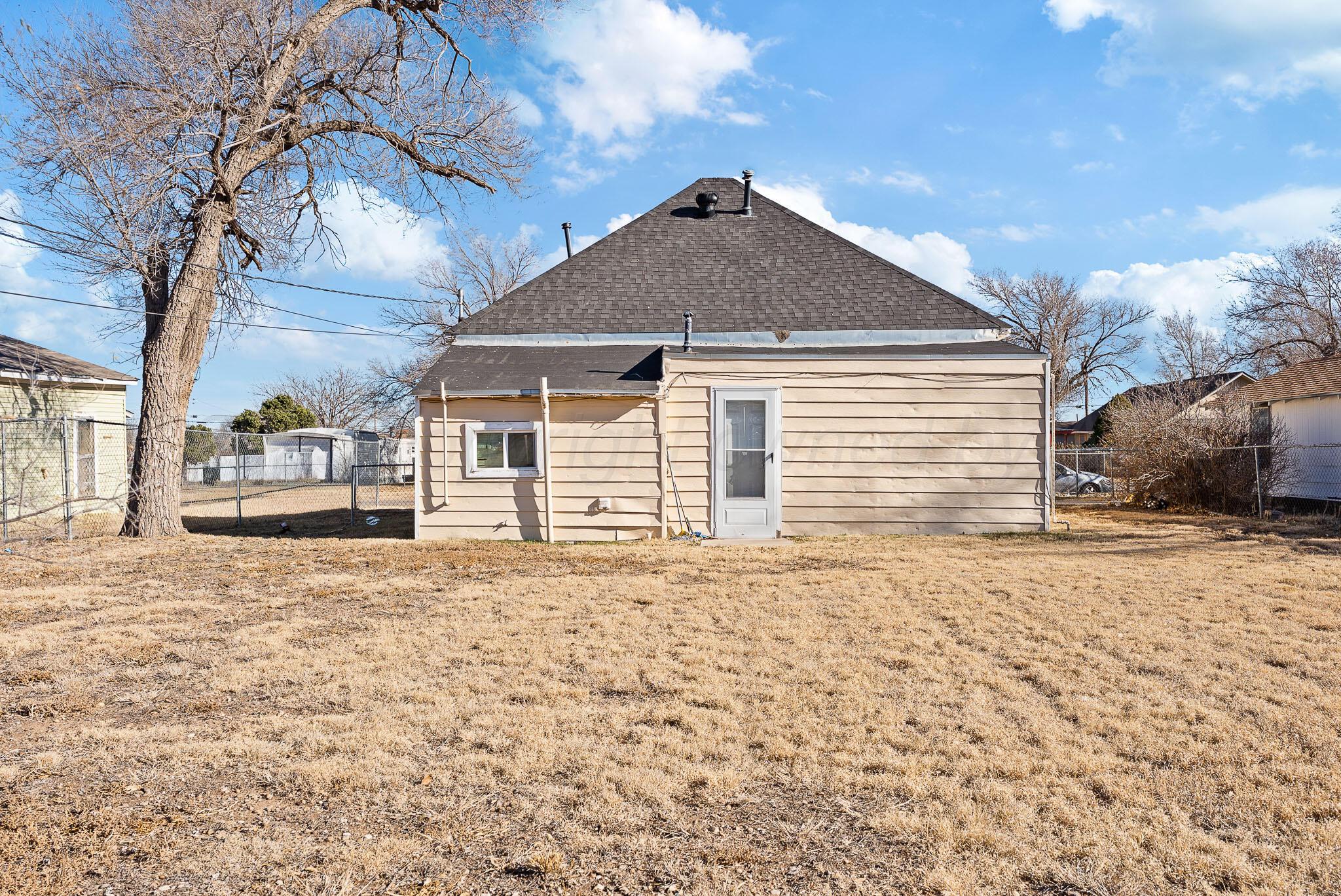 702 South Cleveland Street Amarillo, TX 79102 - Photo 10 of 11 a front view of a house with a yard