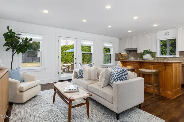 a kitchen with a stove and white cabinets