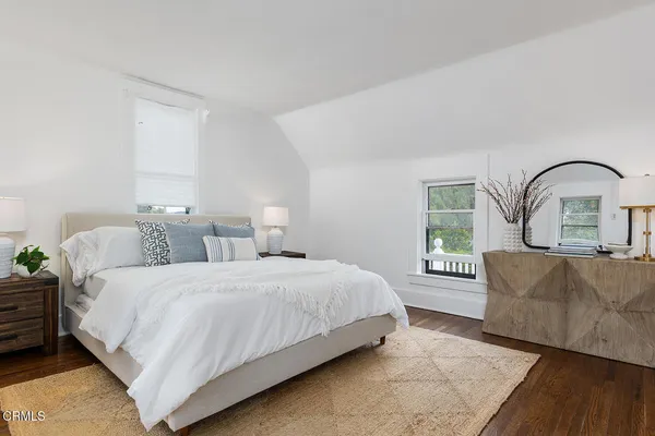 a bedroom with bed and a window