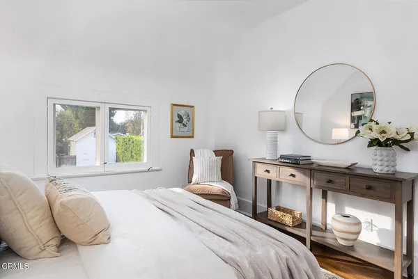 a flower vase and flowers in front of flowers