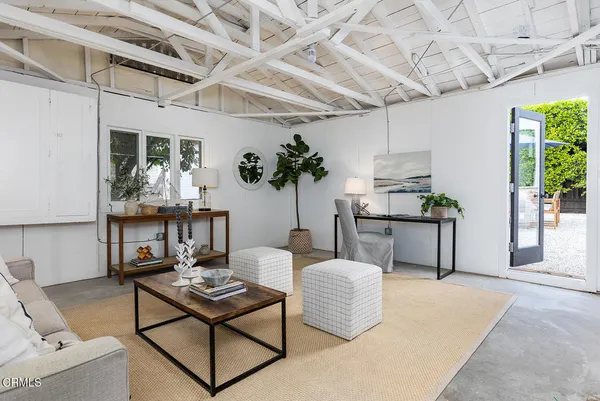 a backyard of a house with table and chairs