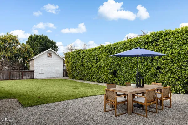 a view of a house with a yard porch and sitting area
