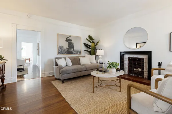 a living room with furniture and a fireplace