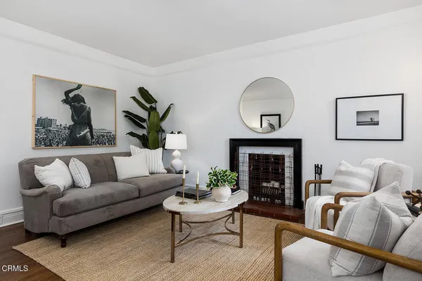 a living room with furniture and a fireplace